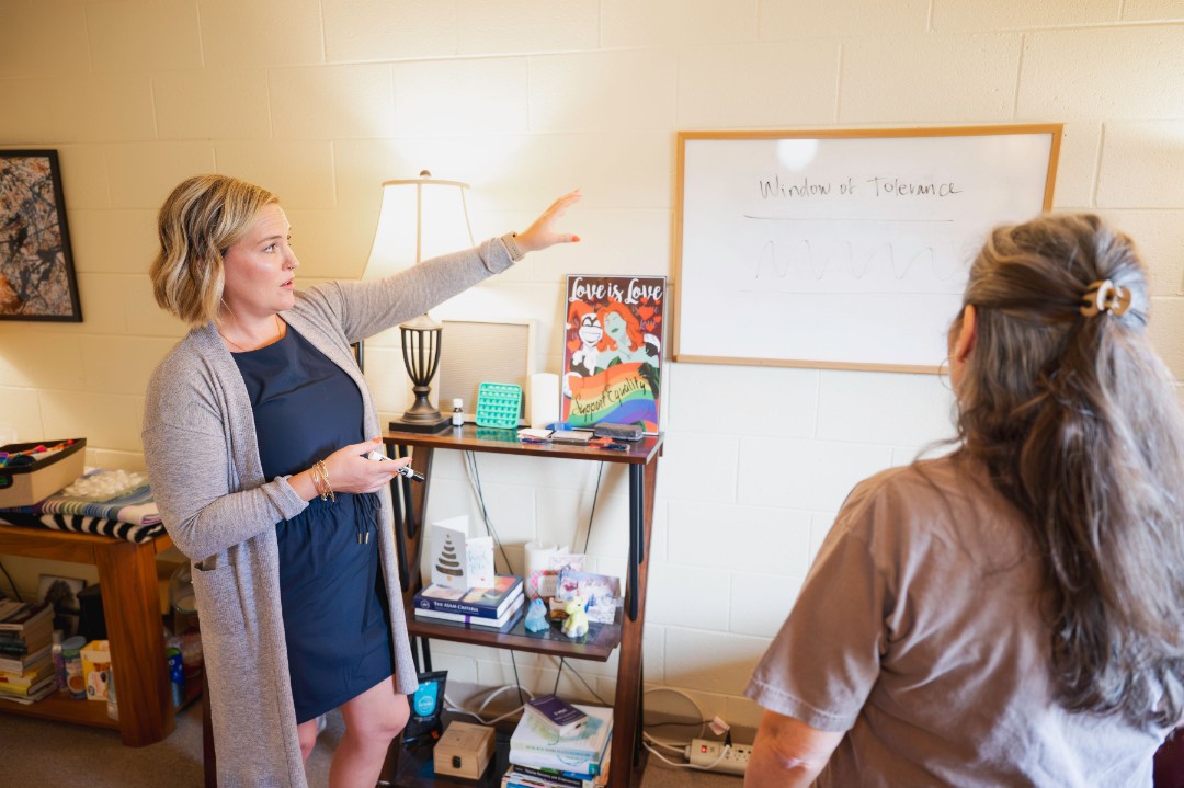 client participating in a court-mandated substance abuse counseling session with a therapist.